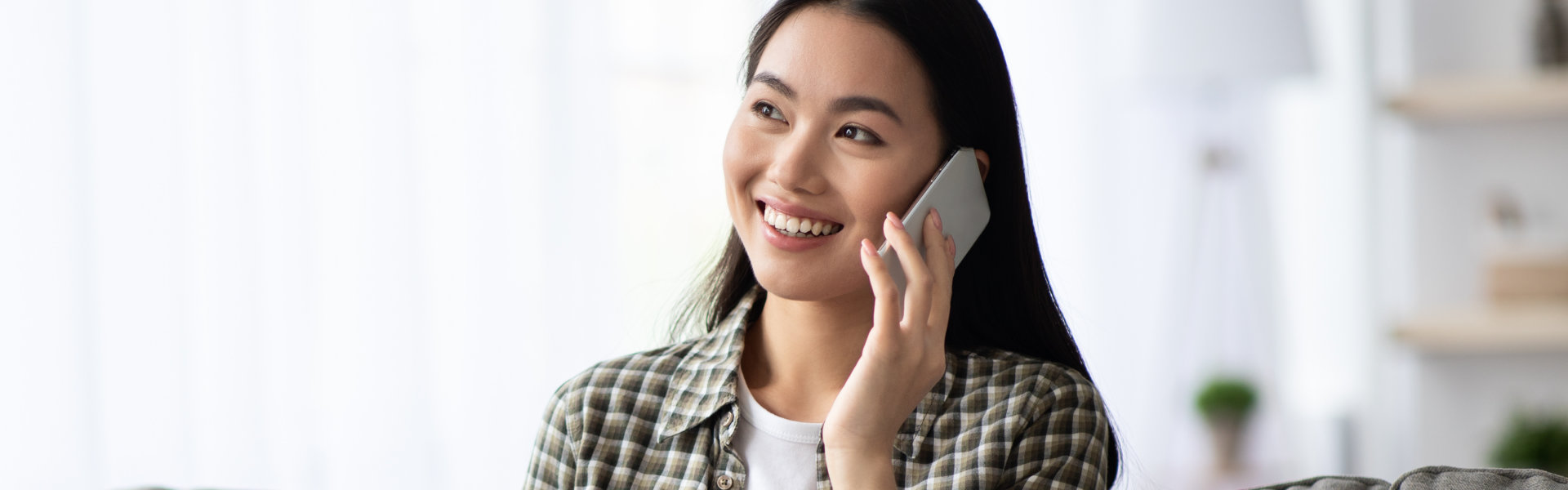 Pretty young woman having phone conversation
