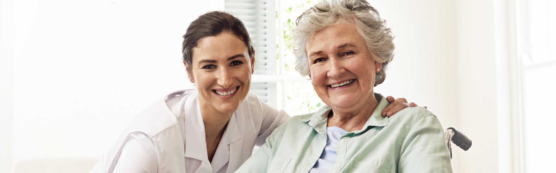 Caregiver helping senior patient