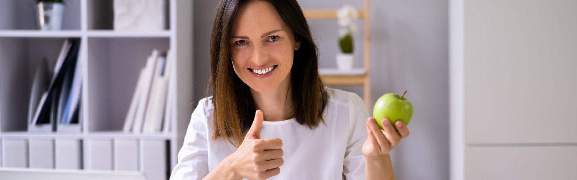 Female Nutritionist Or Dietitian In Laboratory Using Laptop