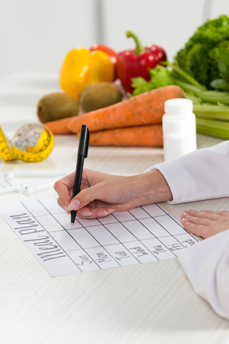 doctor writing meal plan